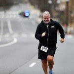 Chris Abraham finishing the 2016 Four Courts Four Miler