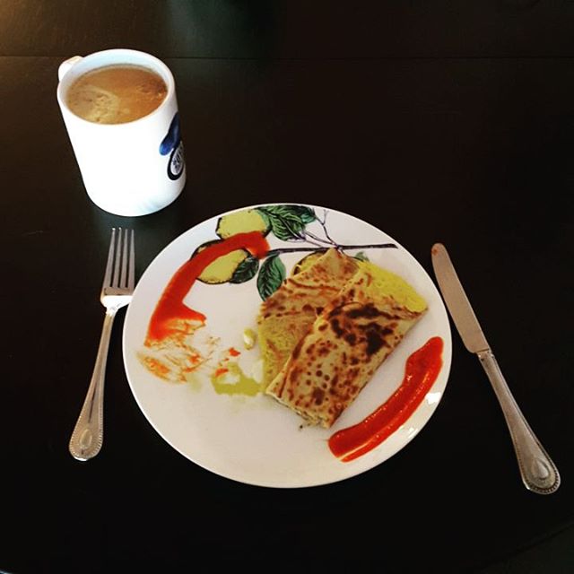 The perfect crepe breakfast with Gruyère cheese and Sriracha sauce and coffee