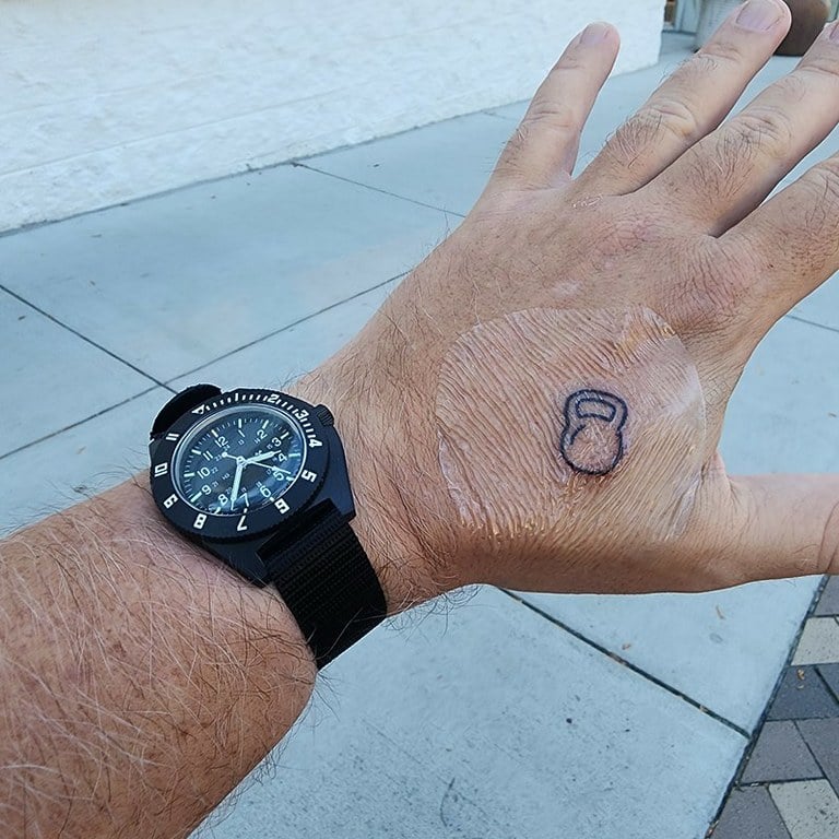 On arm 2010 Marathon Watch Pilot's Navigator with pass through nylon strap and my new kettlebell tattoo