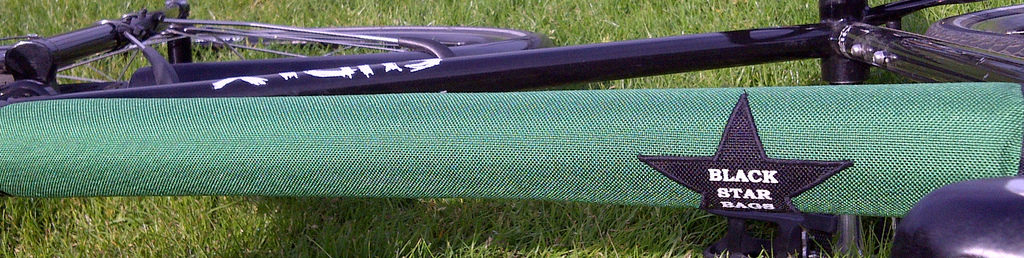 Reversible Black Star top bar pad for my Surly Steamroller in purple and green