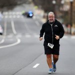 Chris Abraham finishing the 2016 Four Courts Four Miler