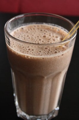 Chocolate banana peanut butter protein shake made with TB12 plant-based protein chocolate powder supplement