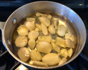 So many raw cloves of garlic simmered in oil go into this amazing anchovies Vinaigrette